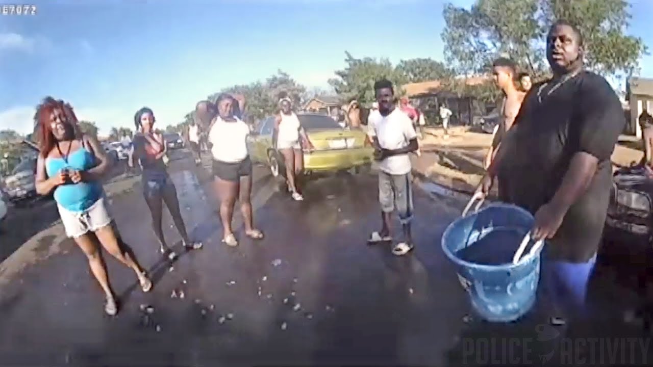 Thumbnail for Female Cop Gets Sprayed by People With Water Guns